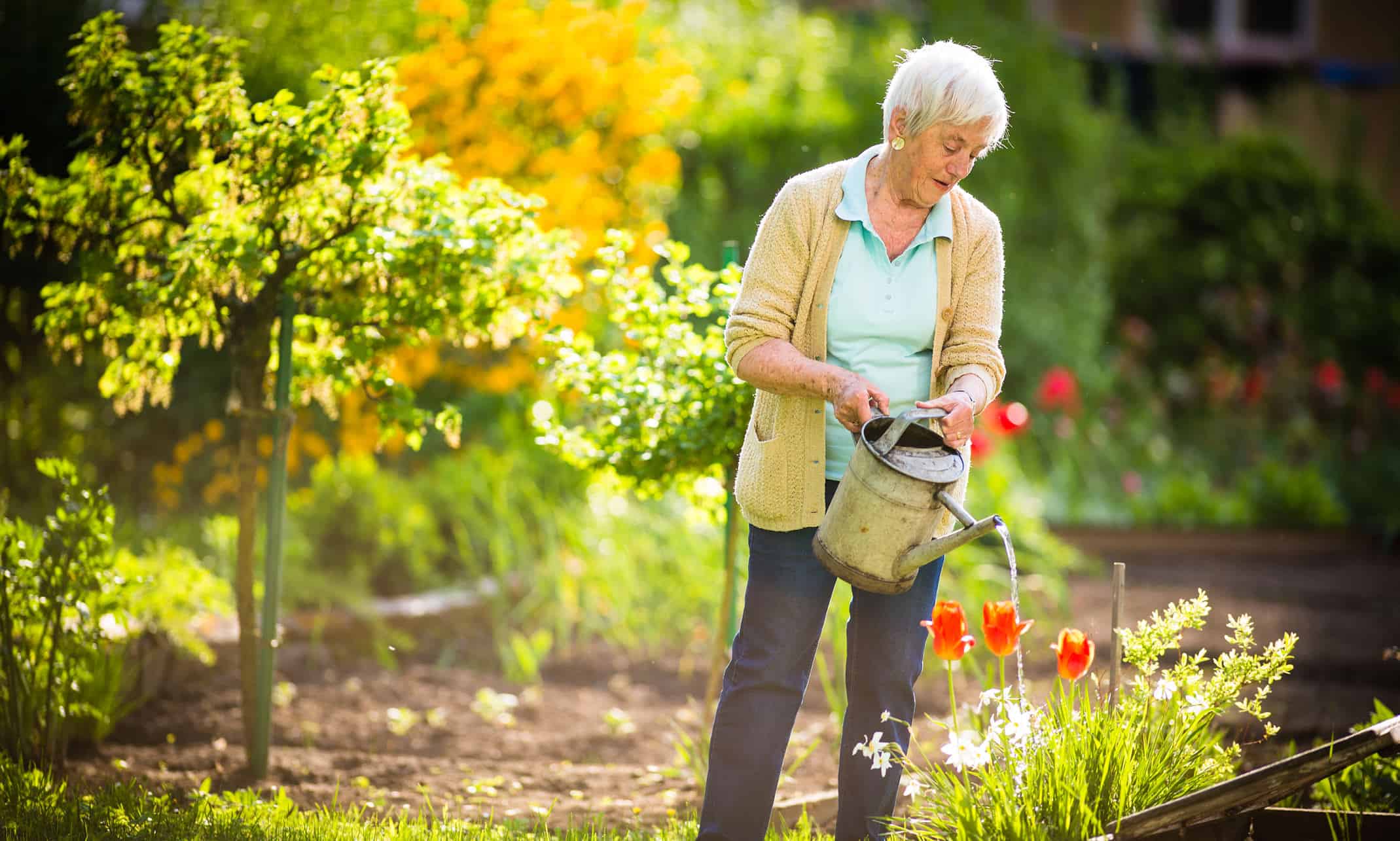 Testimonials of outstanding care - lady watering the garden